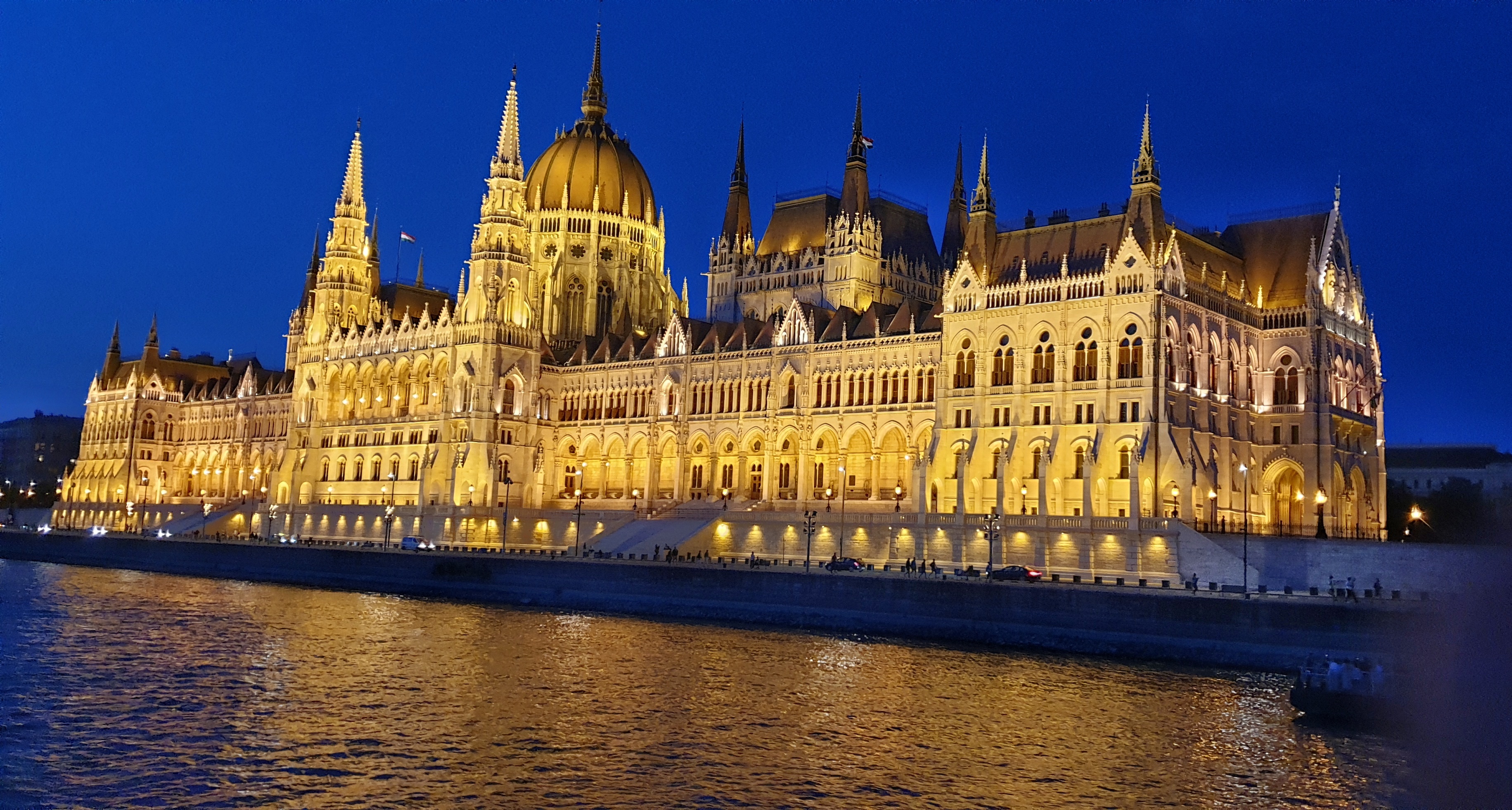 Parliament House lit up at night as seen from the Danube River